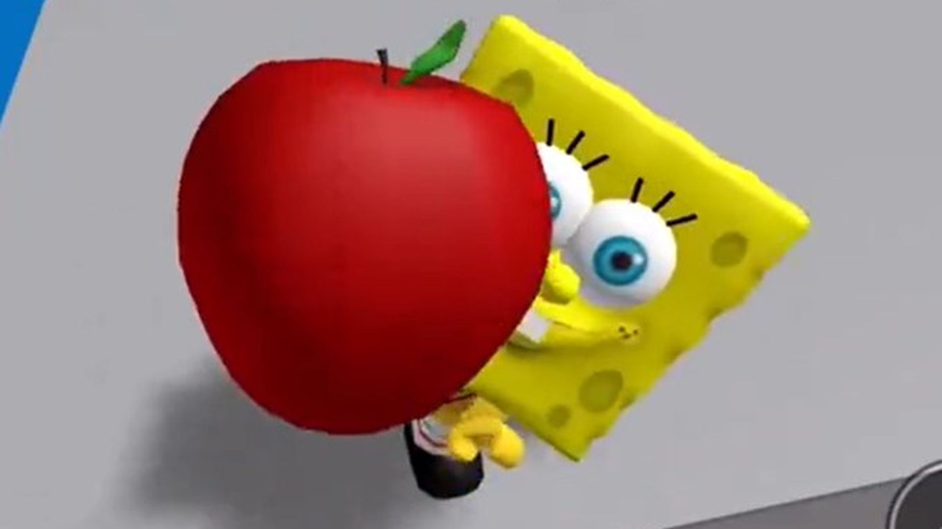 Bob Esponja mostrando una manzana