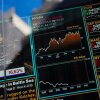 Los gráficos de televisión se ven en la ventana de la sede de Nasdaq en Times Square.