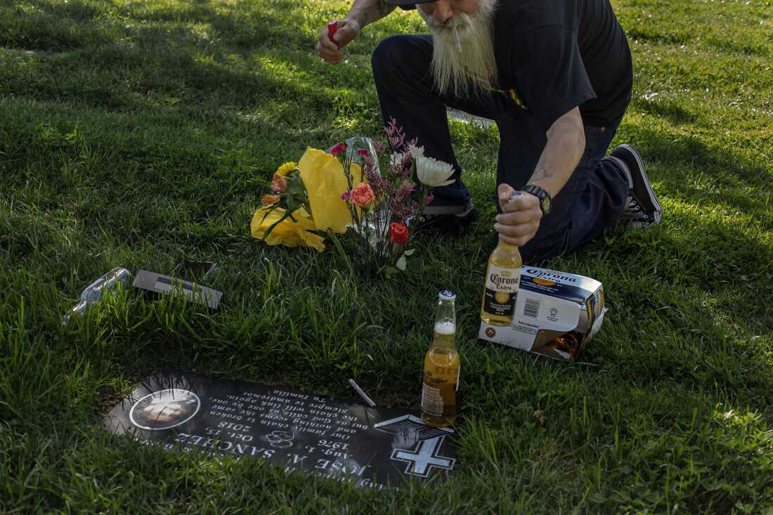 UNITED STATES, LA - Marcel Campos, lead singer of Spaghetti Cumbia, visits the grave of an old friend in Lancaster before a gig on March 26, 2022. The band Spaghetti Cumbia created their own sub-genre by combining cumbia with western styles and rock ’n roll. They grew up on the east side of Los Angeles when gang violence plagued the area; the members turned to music as an alternative path. Now, they rock clubs, while keeping day jobs to support their families.