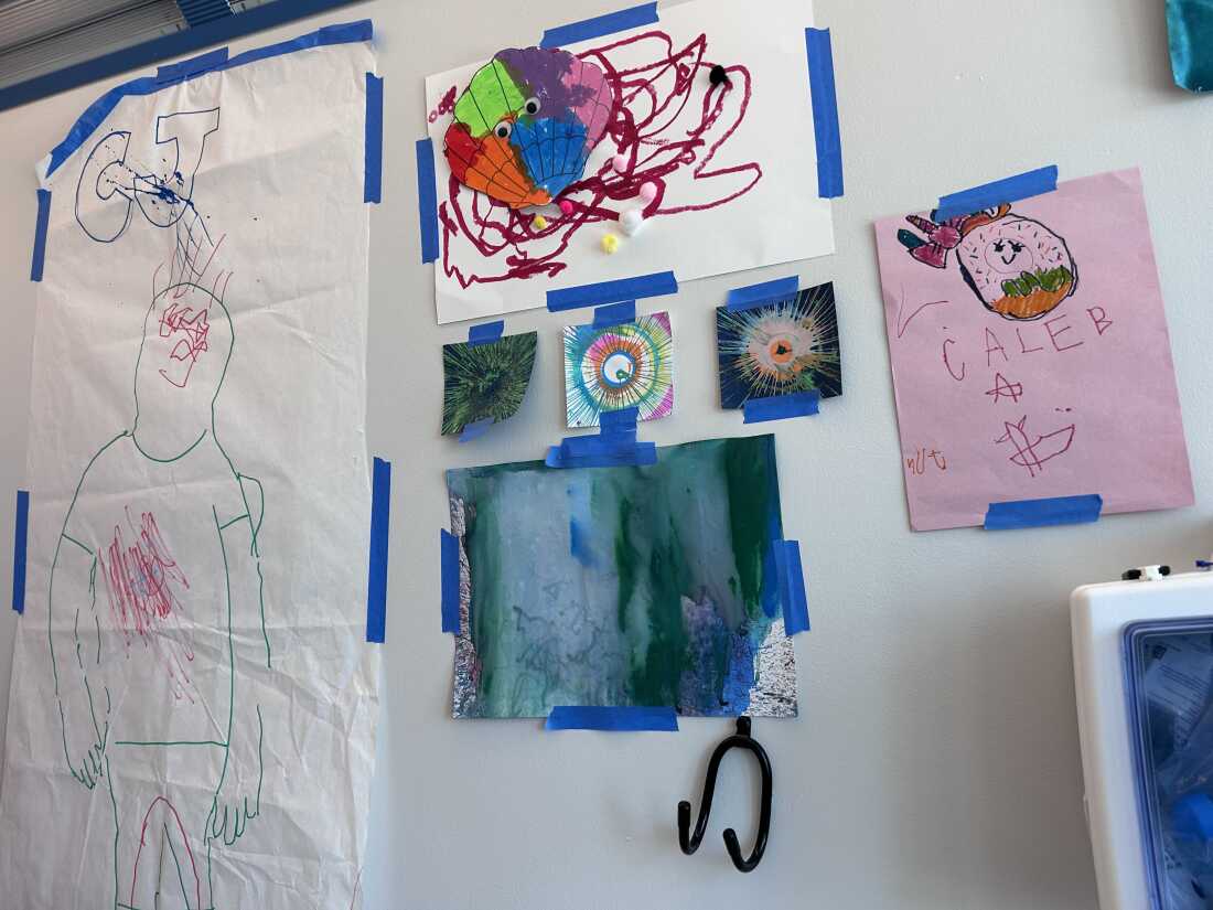 Children's drawings and other art hang on the wall in Caleb's room at Children's Hospital of Philadelphia.