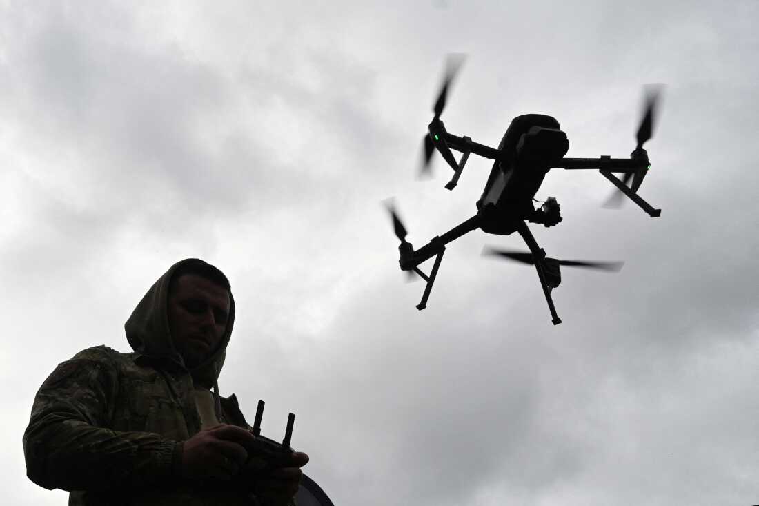 A Ukrainian serviceman operates a drone during a racing competition, which simulates combat conditions, in Kamianets-Podilskyi, Khmelnytskyi region, on Oct. 5, 2025, amid the Russian invasion of Ukraine.