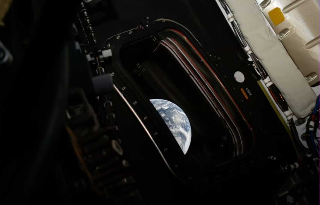 An image of Earth taken by NASA’s Artemis II astronaut commander Reid Wiseman inside the Orion capsule.